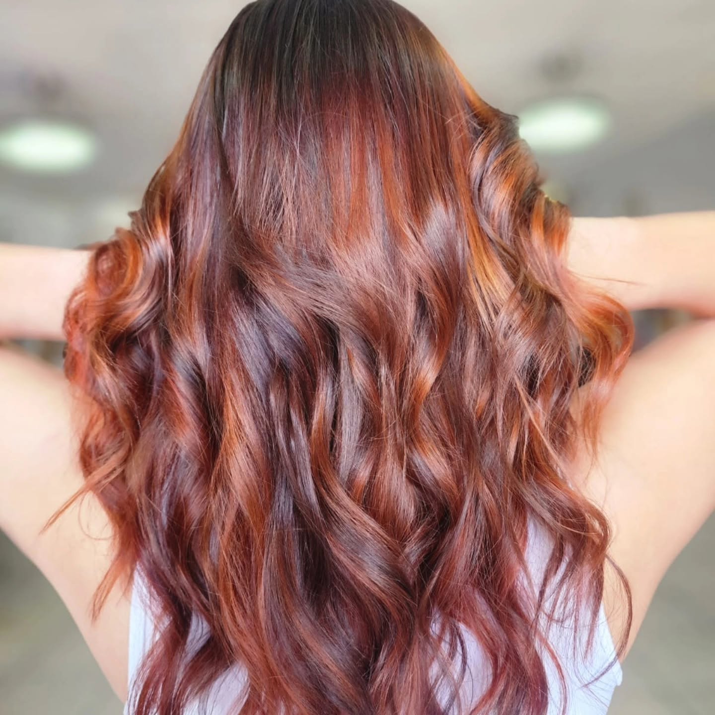 Glossy auburn-copper waves after a restorative treatment — Belle Vee, George